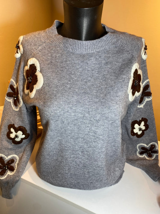 Grijze trui met bruin/witte bloem